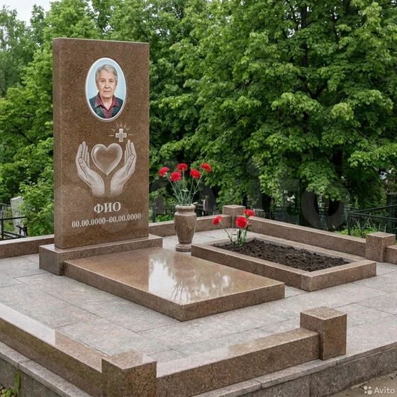Гранитный памятник врачу с белым крестом